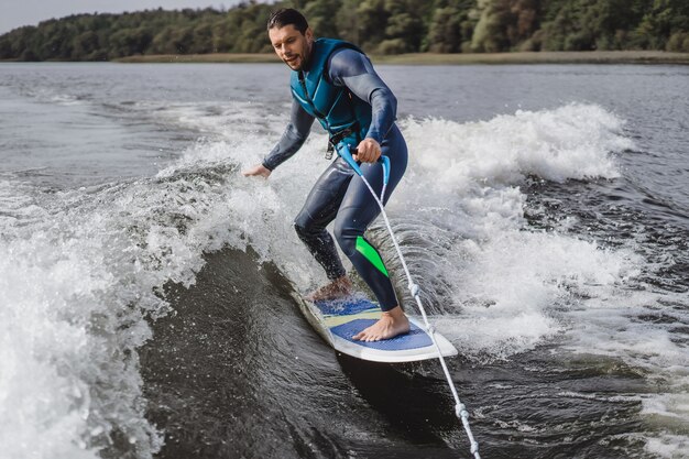 man on wakesurfing. wave from the boat.