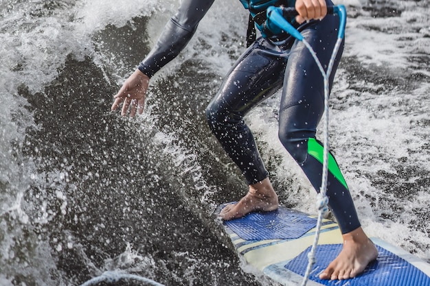 Free photo man on wakesurfing. wave from the boat.