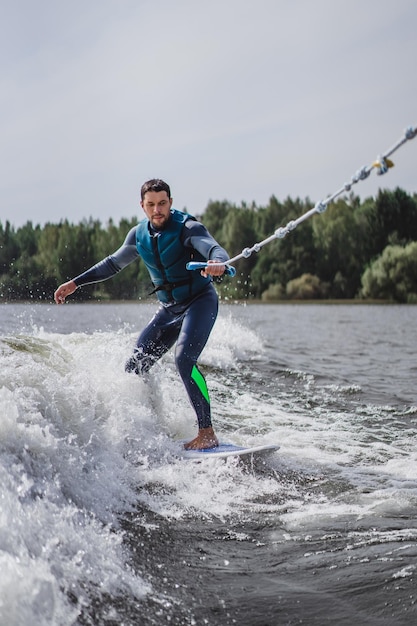 man on wakesurfing. wave from the boat.