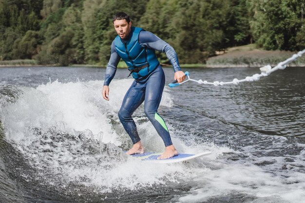 man on wakesurfing. wave from the boat.