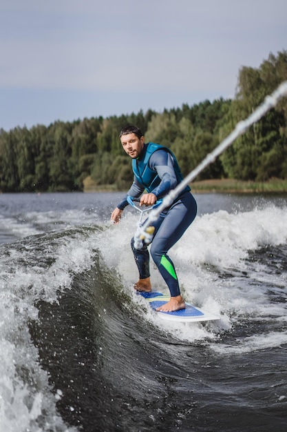 man on wakesurfing. wave from the boat.