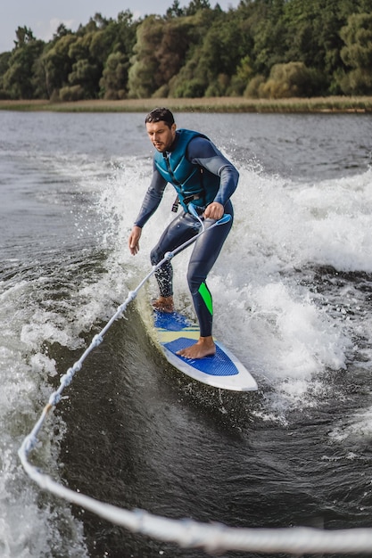 man on wakesurfing. wave from the boat.