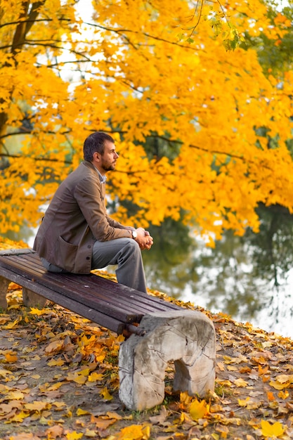 man walking in the autumn park