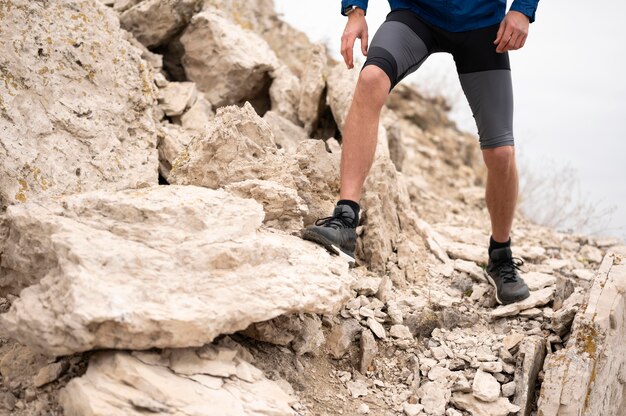 Man walking through rocks in nature