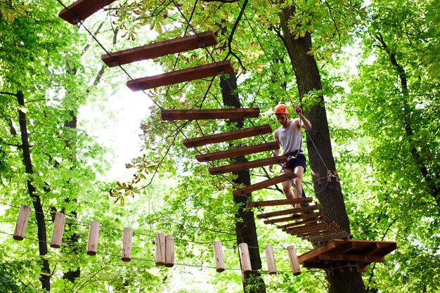 Man walks on the rope path in the air