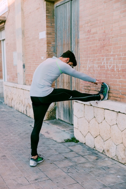 Man warming up on street