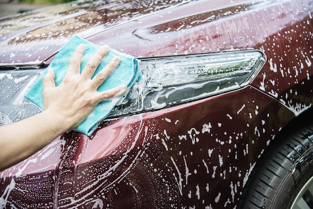 Man wash car using shampoo