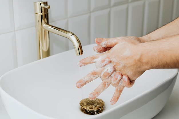 Man washing hands with soap