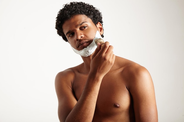 Man watching aside and shaving