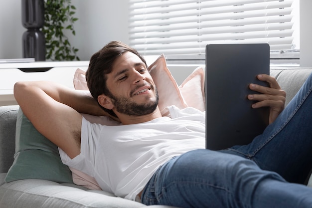 Man watching his favorite movie on a tablet