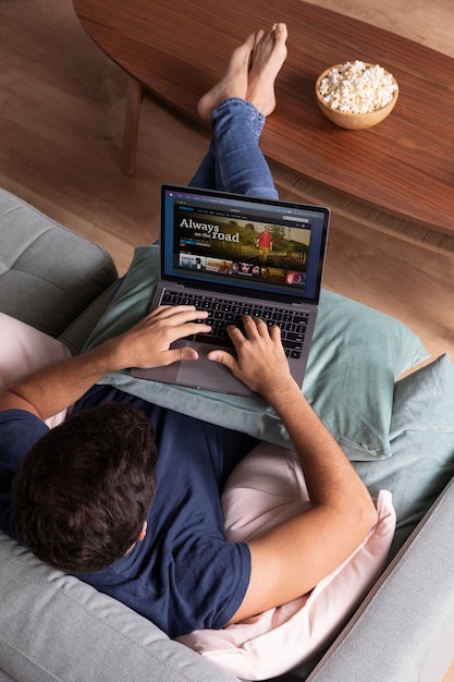 Man watching streaming service on his laptop