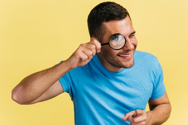 Man watching through a magnifier 