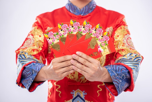 Man wear Cheongsam suit gives his family a gift To be a lucky person in the Chinese New Year