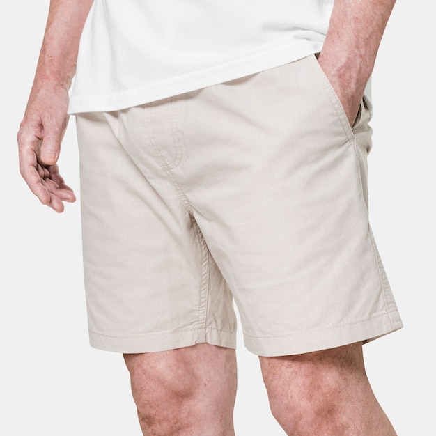 Free Photo man wearing beige shorts close-up