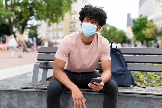 Man wearing face mask outdoors