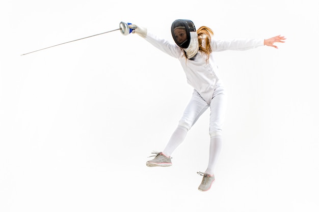 Free photo man wearing fencing suit practicing with sword