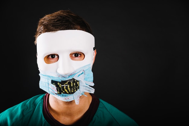 Free Photo man wearing halloween mask