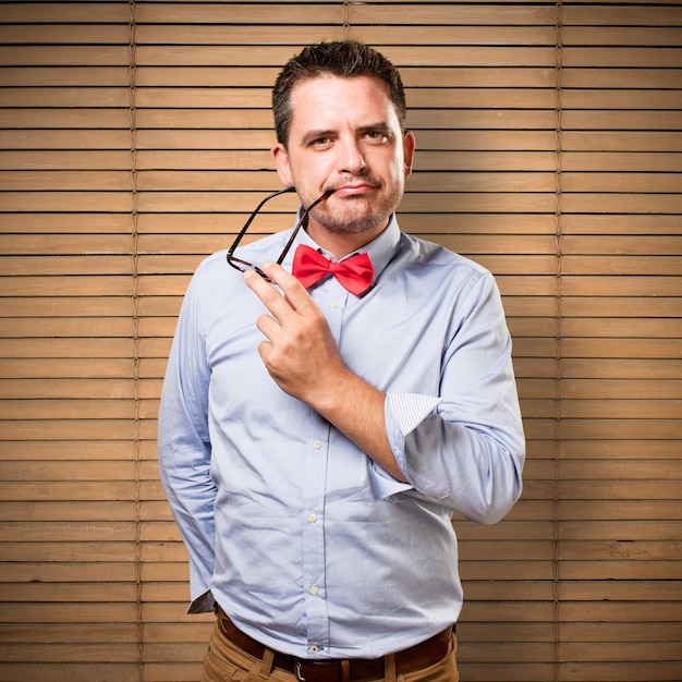 Free photo man wearing a red bow tie. looking sexy.