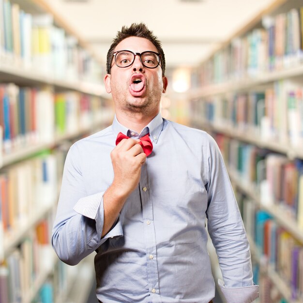 Man wearing a red bow tie. Looking weighed down.