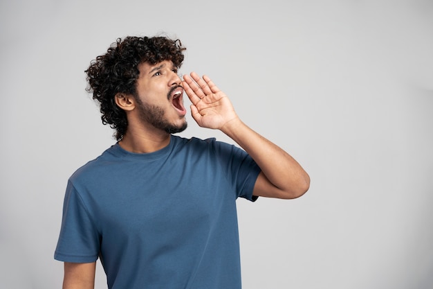 Man wearing t shirt gesturing