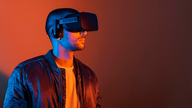 Man wearing vr glasses  with orange light