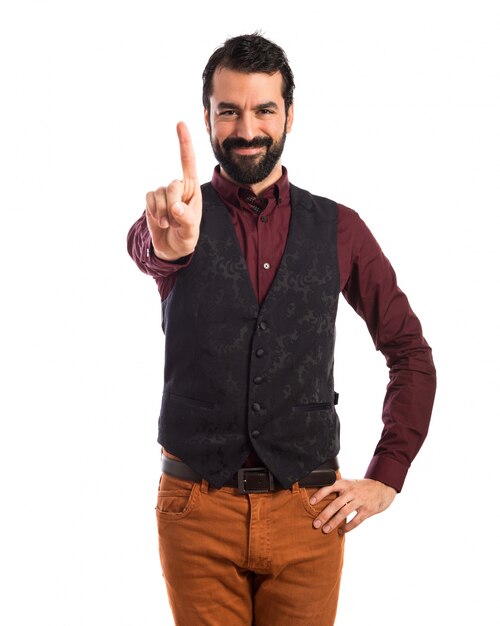 Man wearing waistcoat counting one