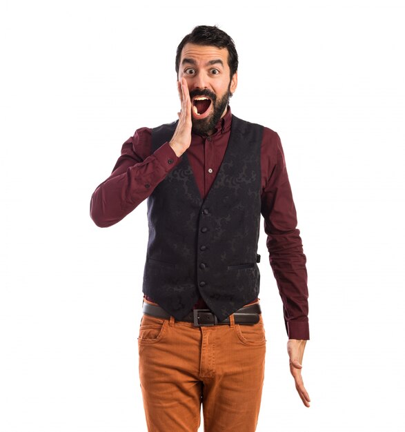 Man wearing waistcoat doing surprise gesture