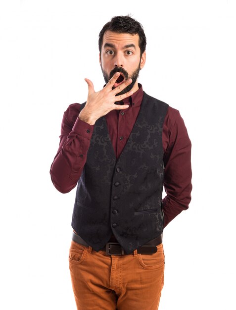 Man wearing waistcoat doing surprise gesture