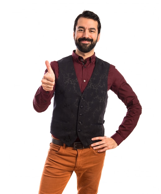 Man wearing waistcoat with thumb up