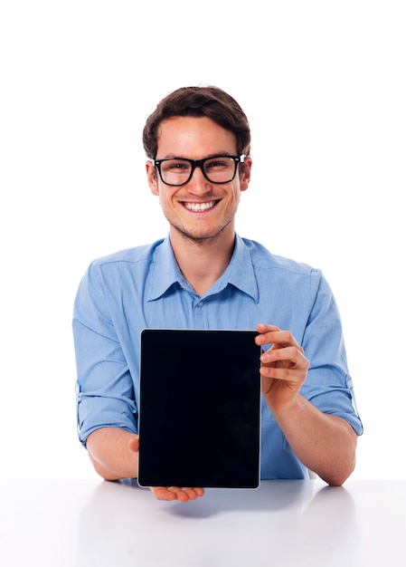 Man wearning on glasses showing screen of digital tablet