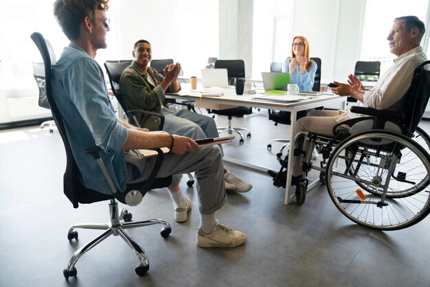 Man in a wheelchair having an office job