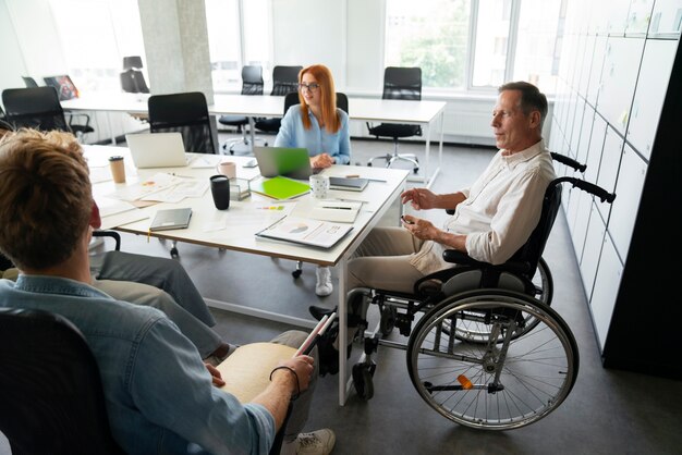 Man in a wheelchair having an office job