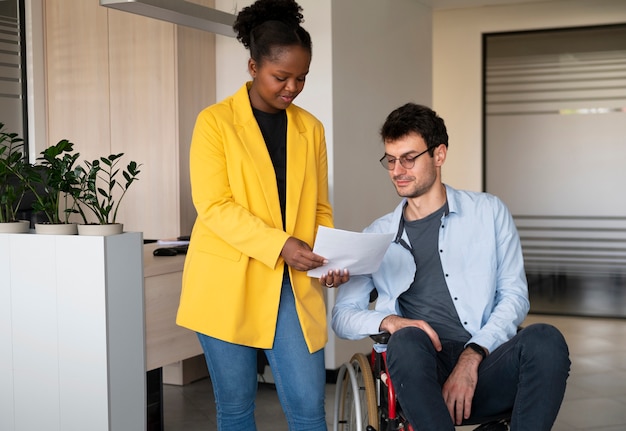 Man in wheelchair at work front view