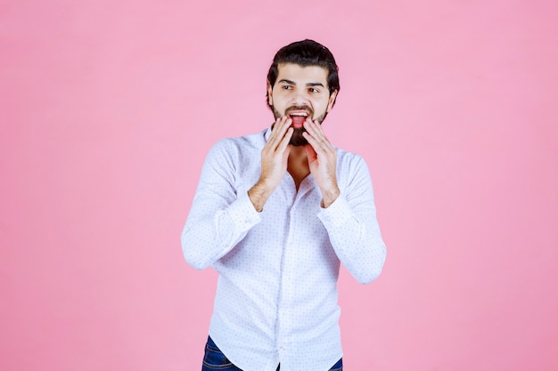 Man in a white shirt giving smiling and positive poses.