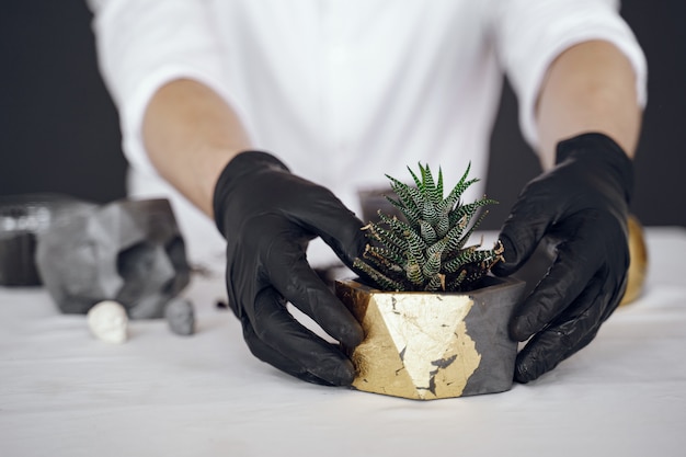 Free photo man in a white shirt works with a cement