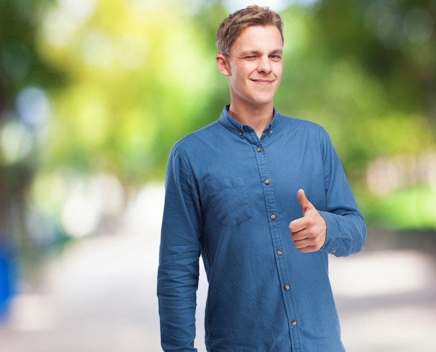 Man winking with a thumb up