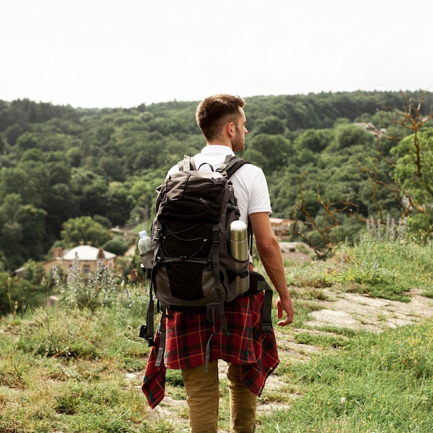 Man with backpack on road