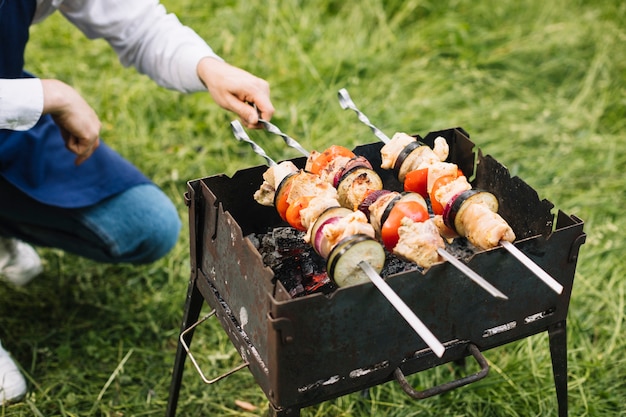 Man with a barbecue in nature