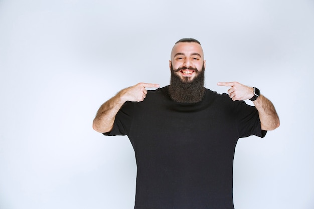 Man with beard giving appealing poses.