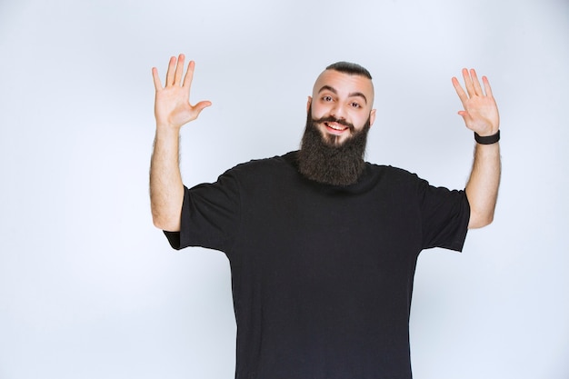 Free Photo man with beard greeting his friends. 