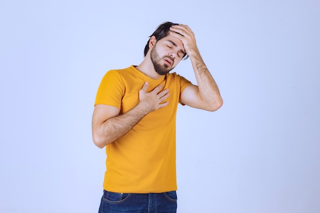 Free Photo man with beard has headache and feels sick