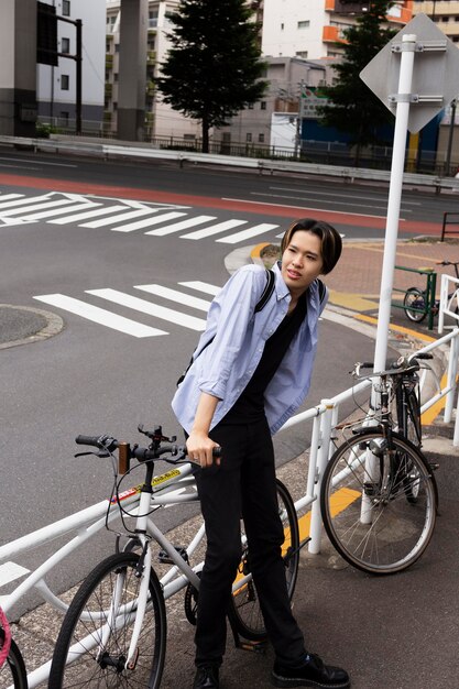 Man with bicycle in the city