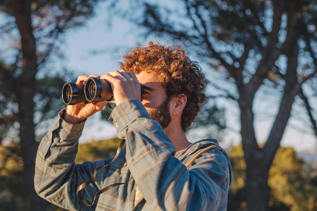 Man with binoculars in nature