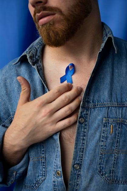 Man with blue november ribbon