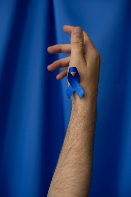 Man with blue november ribbon