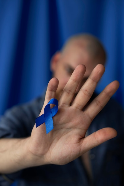 Man with blue november ribbon