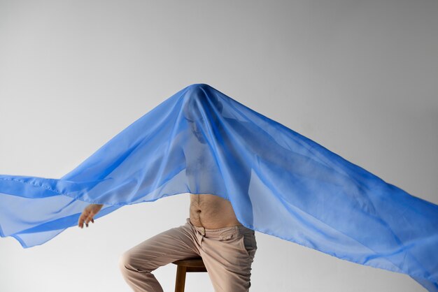 Man with blue scarf on his head