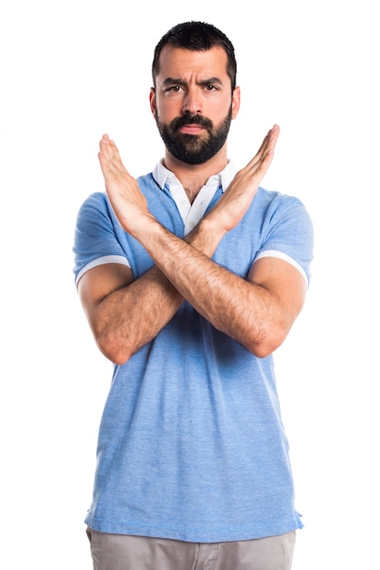 Free photo man with blue shirt doing no gesture