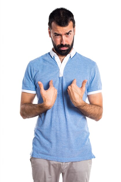 Man with blue shirt doing surprise gesture