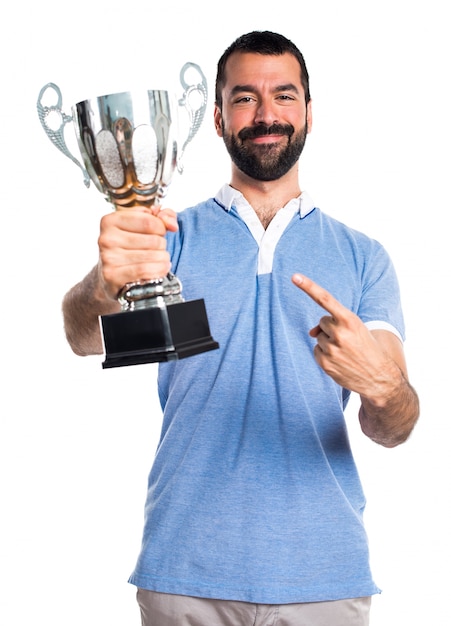 Free photo man with blue shirt holding a trophy